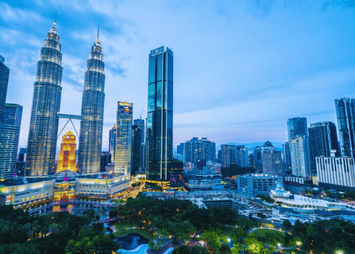 Tourist exploring Kuala Lumpur skyline - Malaysia Visit Visa Services